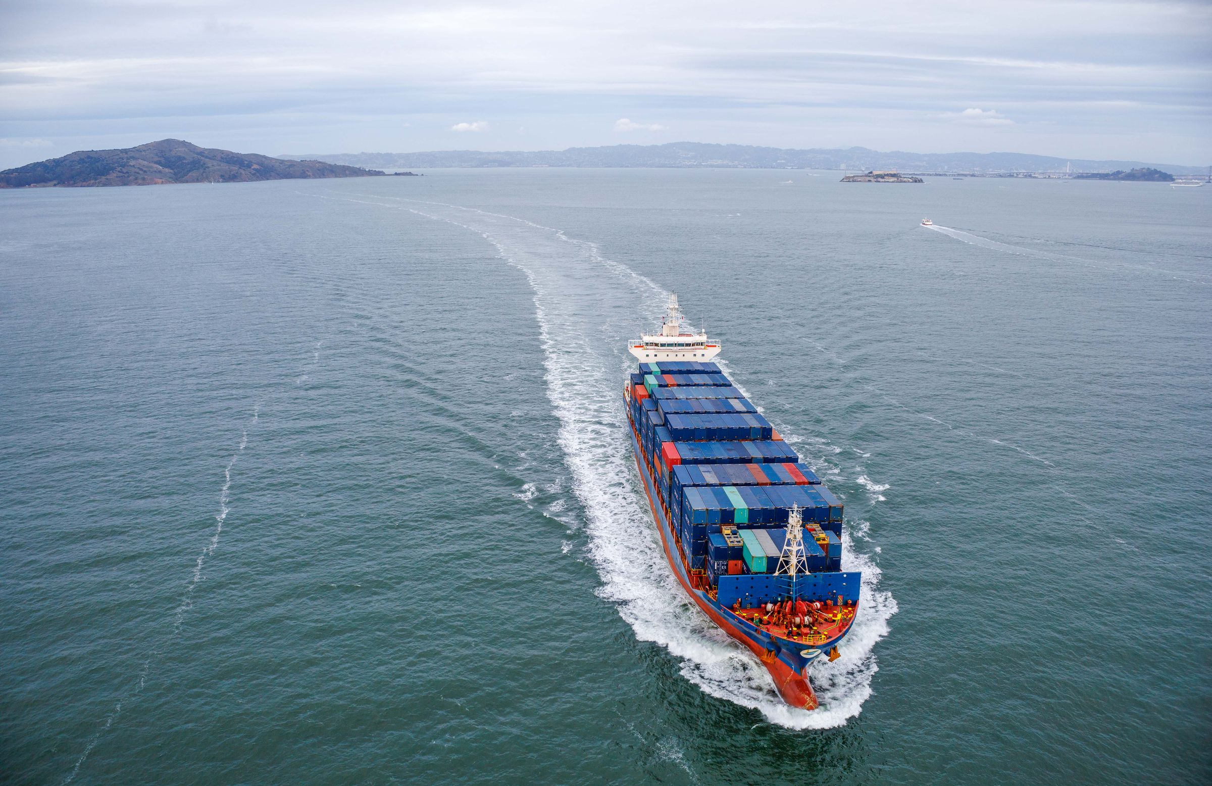 Container ship carrying cargo across the ocean